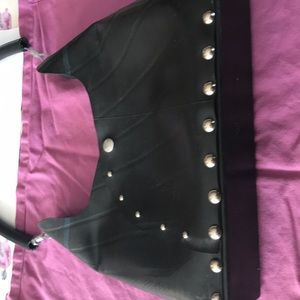 Up-cycle handbag made from repurposed tires.